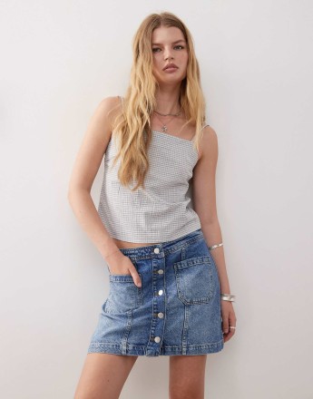 Reclaimed Vintage denim button through mini skirt in mid-wash blue