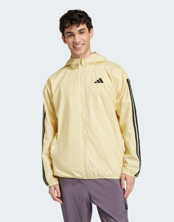 adidas Essentials 3-stripes windbreaker in powder yellow / black