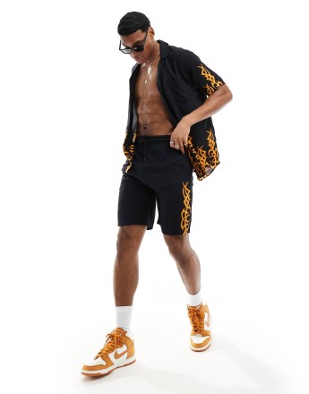 Criminal Damage print shorts in black & multi