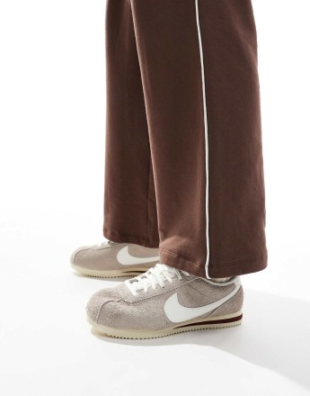 Nike Cortez trainers in beige and white