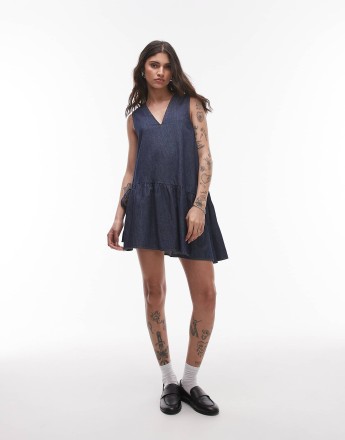 Topshop denim mini dress with peplum hem and bow detail in raw look indigo