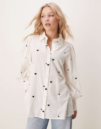 YAS oversized shirt with heart embroidery and ruffle trim detail in white