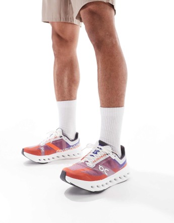 ON Cloudsurfer Next running trainers in red and blue